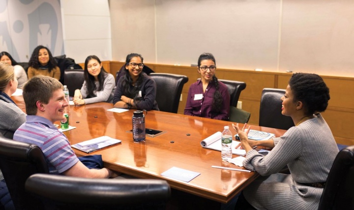 people sitting around a conference room table