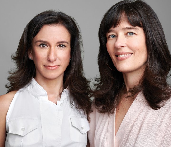 Two women, both with dark hair