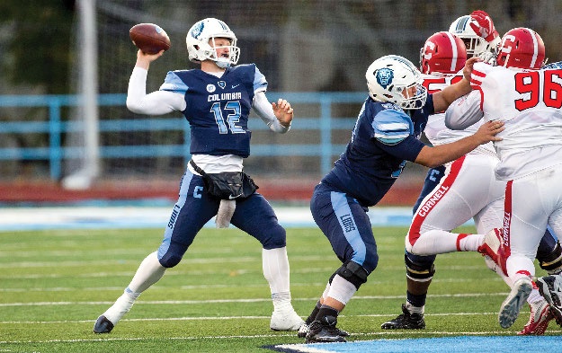 A Columbia Lions football player prepares to throw the football.