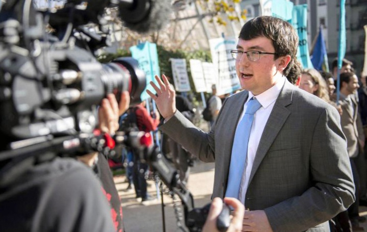 Alex Loznak ’19 giving a media interview outdoors.