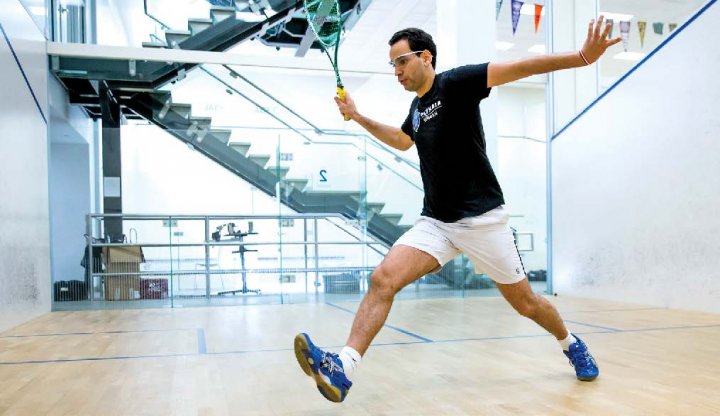 A man playing squash