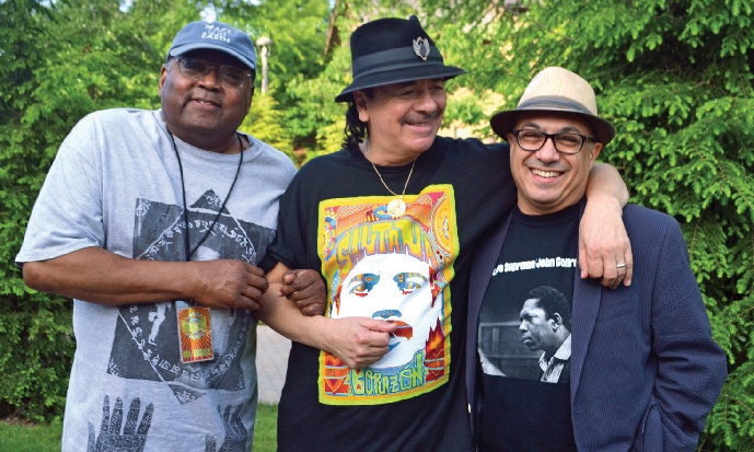 Ashley Kahn ’83 (far right) with Carlos Santana (center) and Hal Miller, Kahn’s co-author on Santana’s 2014 memoir, backstage at a Santana gig in Woodstock, N.Y., on June 15, 2014.