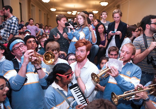 Young men and women playing instruments