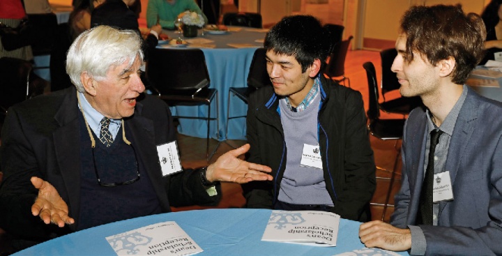 Three people sitting at a table