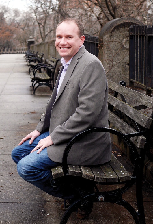 A man sitting on a park bench