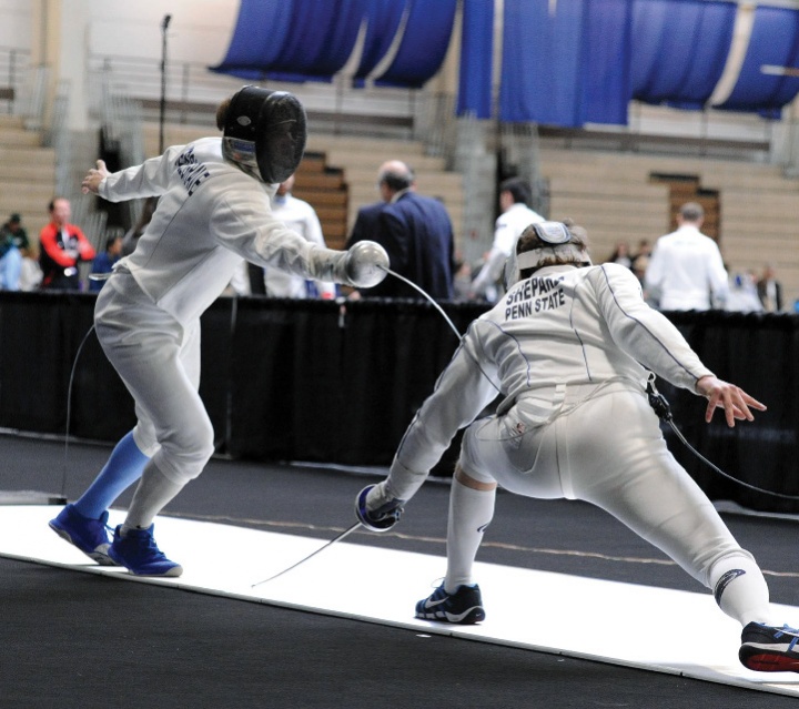 An action shot of fencers