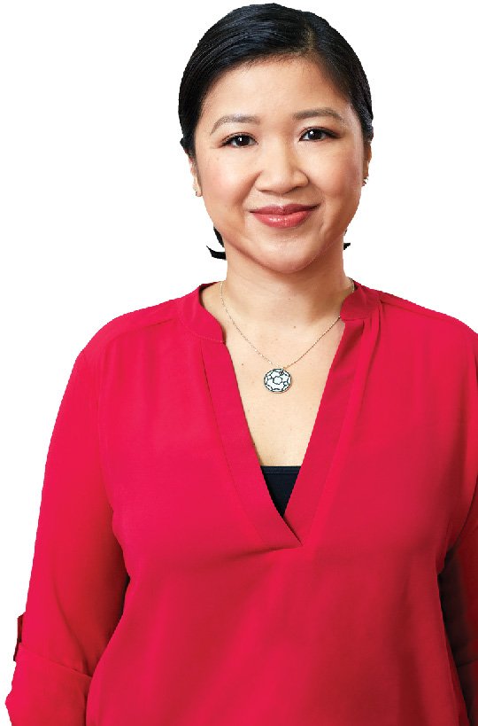An Asian woman in a red shirt