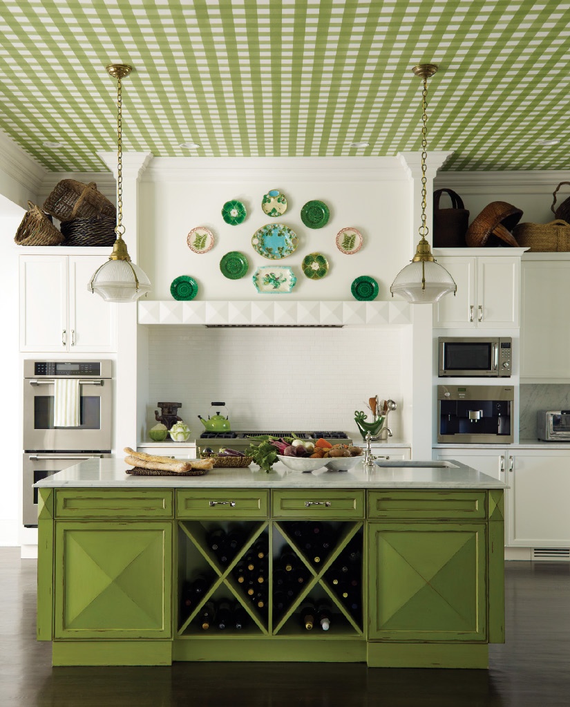 A kitchen decorated in shades and patterns of green