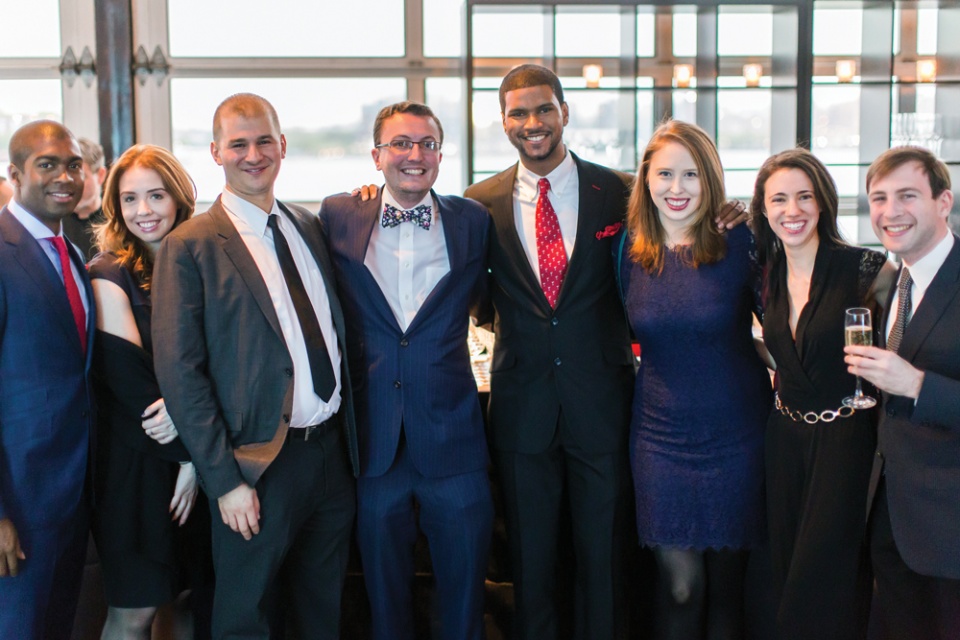 A group of men and women in formalwear