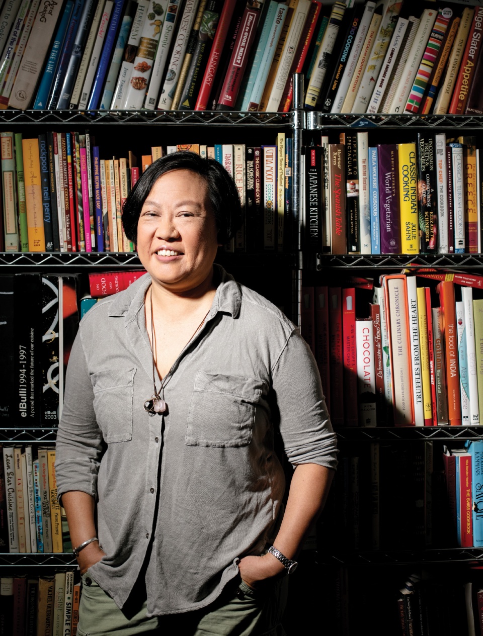 Anita Lo ’88 stands in front of a bookshelf.