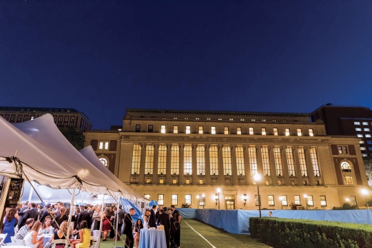 An illuminated class dinner on South Lawn.