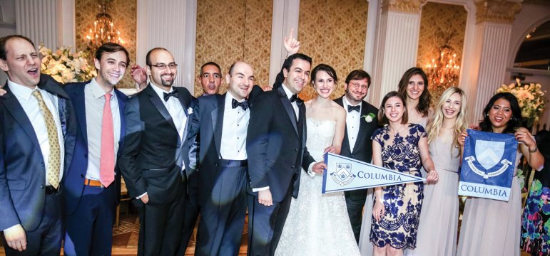 a wedding party with a Columbia banner