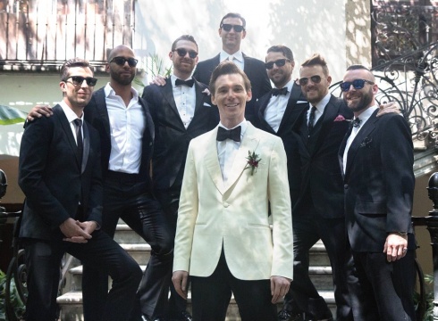 a group of men in sunglasses