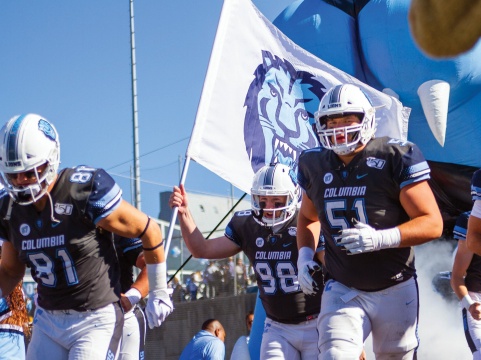 Three Columbia Lions football players.