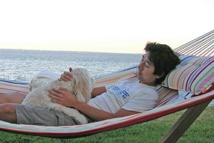 Robert Ryang ’02 relaxes with his dog, Daisy.