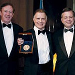 Mark E. Kingdon ’71 displays the Alexander Hamilton Medal along with (from left) Dean Austin Quigley, Alumni Association President Brian C. Krisberg ’81