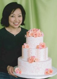 Sonya Cho Hong ’91, owner and designer for Butterfly Cakes, 
				      a specialty cake shop in Burlingame, Calif., shows off one of her creations