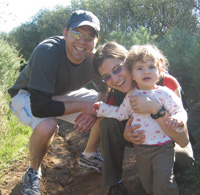 Rabbi Sharon Brous ’95, with her husband, David Light ’95, and their daughter, Eva Brous-Light.