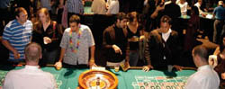 Young alumni take their chances with Columbia Cash at Casino Royale.