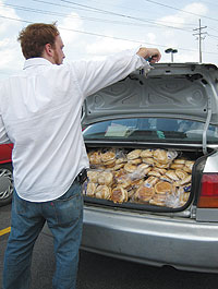Photo of Mark Weiner unloading rolls