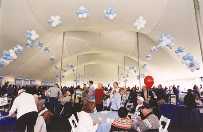 Alumni enjoy the big tent at Homecoming.