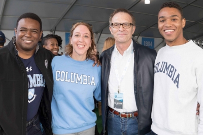 Group photo of Dean Valentini with three Columbia College alumni