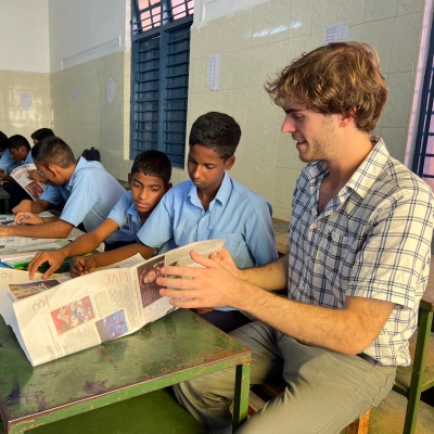 Paul Ward CC’23, a Fulbright-Nehru English teaching assistant in India, works with students in Chennai.