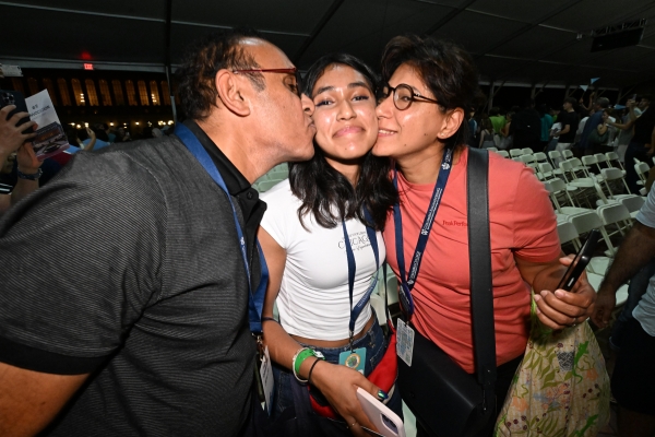 Parents kiss their first-year student on each cheek before departing