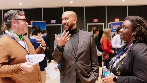 Dean Josef Sorett in discussion with career fair attendees