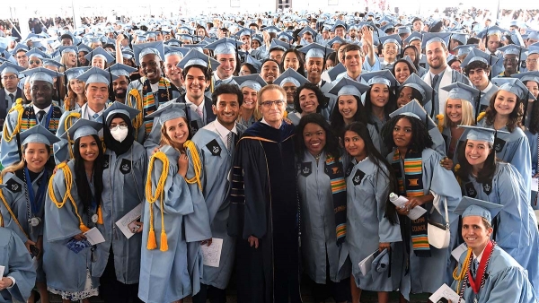 Columbia College students and Dean Valentini in academic regalia
