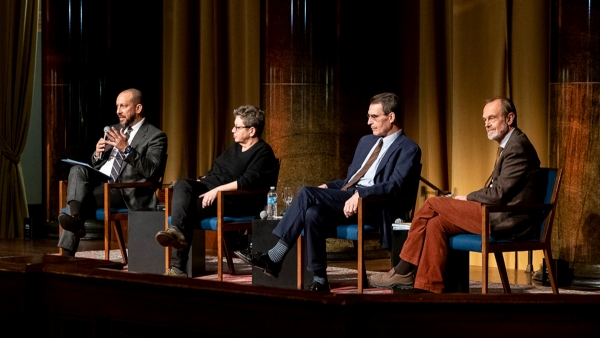 Four panelists in discussion seated onstage in Low Library