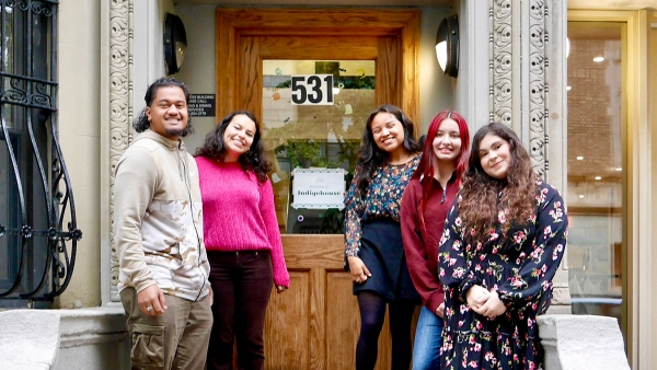 Group of Indigehouse students pose on the stoop