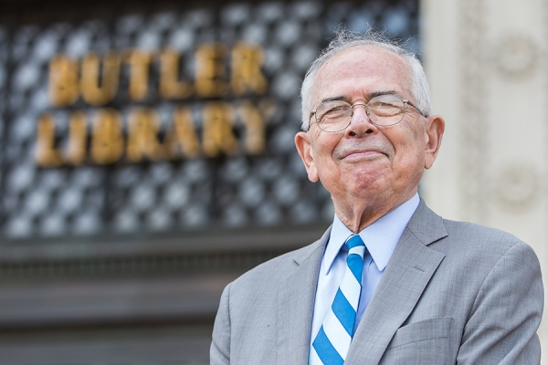 Portrait of Gerald Sherwin CC'55 in front of Butler Library