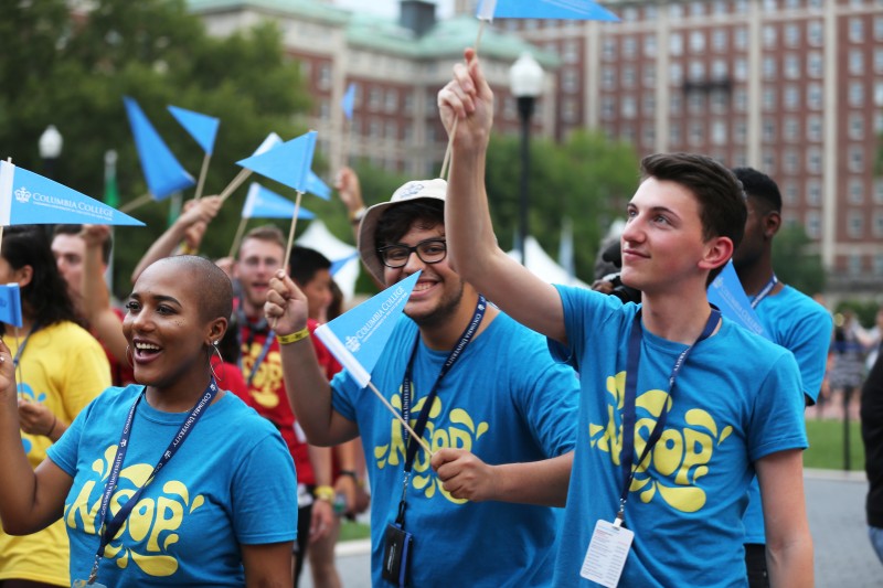 Students waving flag