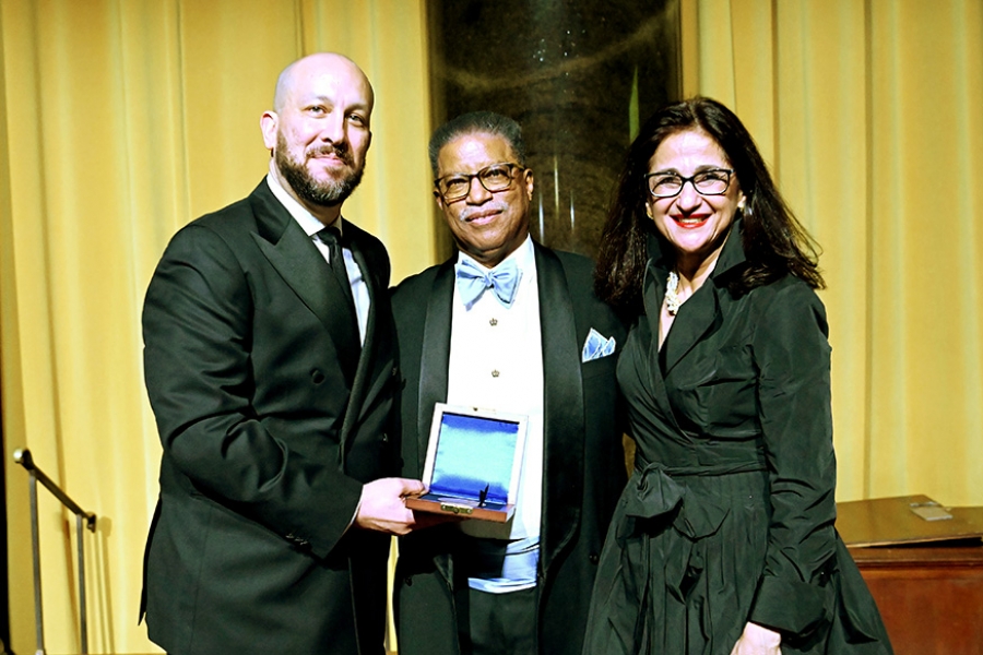 Left to right: Dean Josef Sorett, George Van Amson CC’74, and President Minouche Shafik