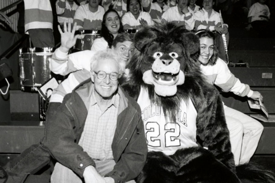 Photo of Robert Berne CC’60, BUS’62 in 2000 with the Lion mascot in the new Lion costume Berne donated.