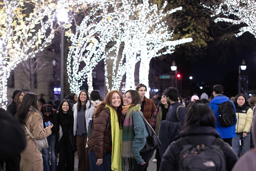 Students pose on College Walk at Tree Lighting 2023.