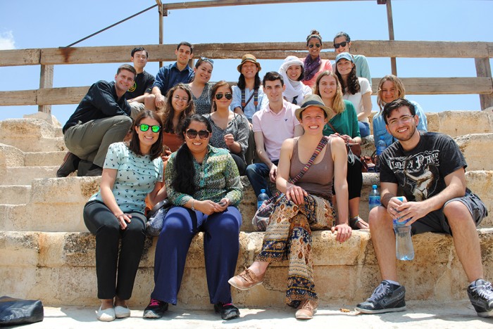 The CEO Amman group poses for a photo at Jerash, in the north of Jordan. Front Row: Jennie Preis, Doreen Mohammad CC’15, Alex Swift CC’15, Jamil Muna CC’15; 2nd Row: Brina Seidel CC’15, Lilia Cherchari CC’15, Chris Godshall CC’15, Kiersten Gourlay SEAS’15, Cordelia Long GS’16; 3rd Row: Mischa Beumer GS’14, Amanda Dancer CC’15, Monica Carty CC’15, Sheiling Chia CC’16, Allison Kammert CC’15. Back Row: Qingxiang Jia SEAS’15, Lucas Oliver CC’15, Meghna Mukherjee CC’15, Tina Garrity CC’15. Photo: Courtesy Meghna Mukherjee CC’15