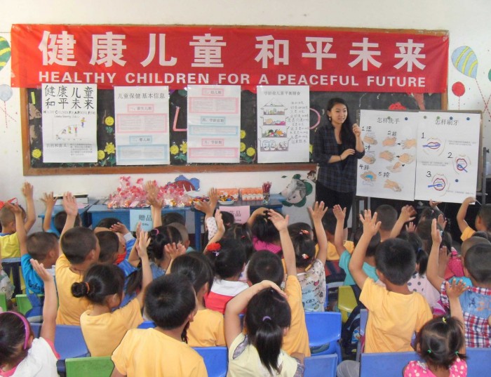 Sida Li CC '15 delivering lessons on proper nutrition, handwashing tips and toothbrushing techniques. PHOTO: Courtesy Sida Li